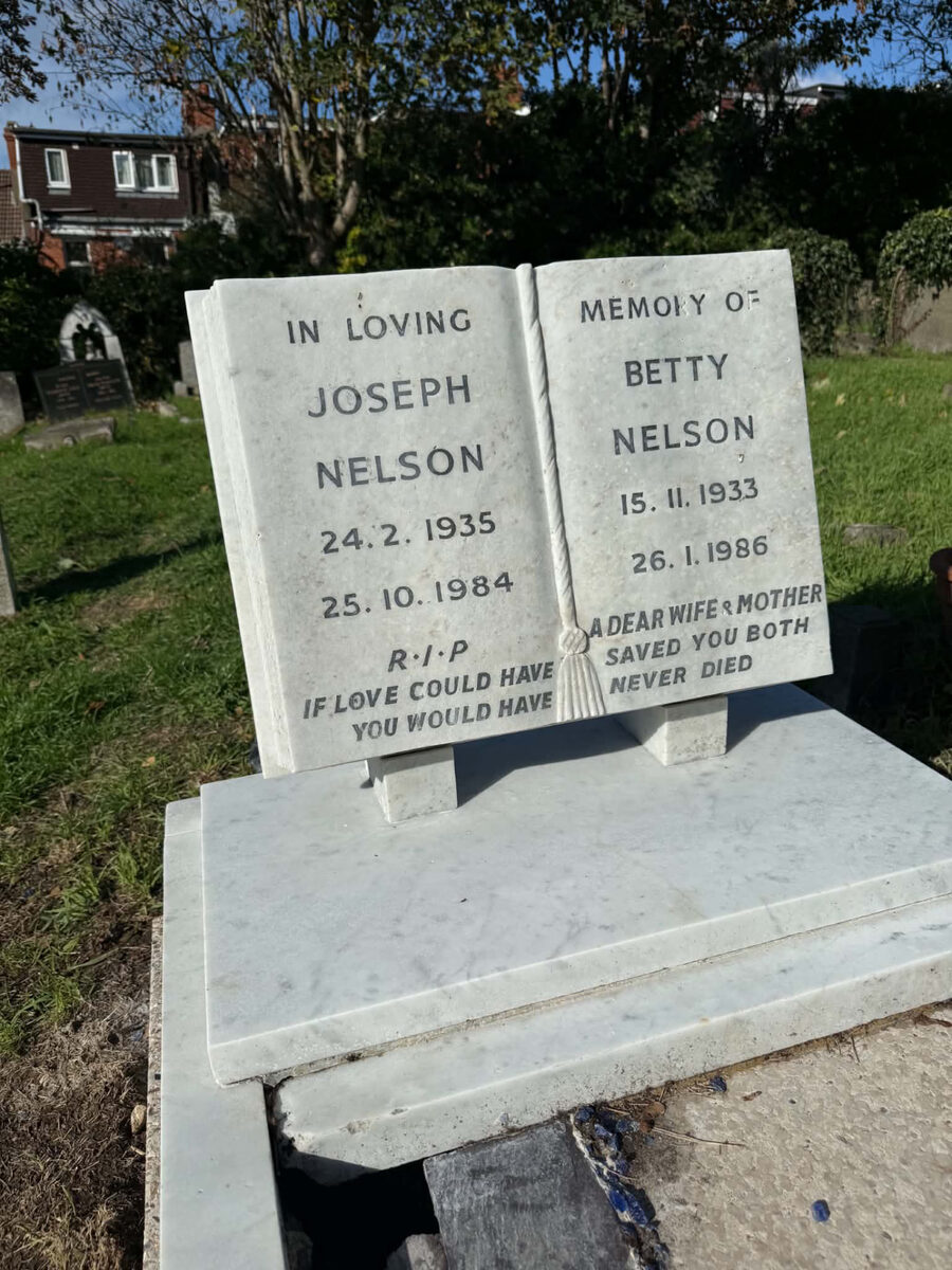 Open-book headstone after cleaning